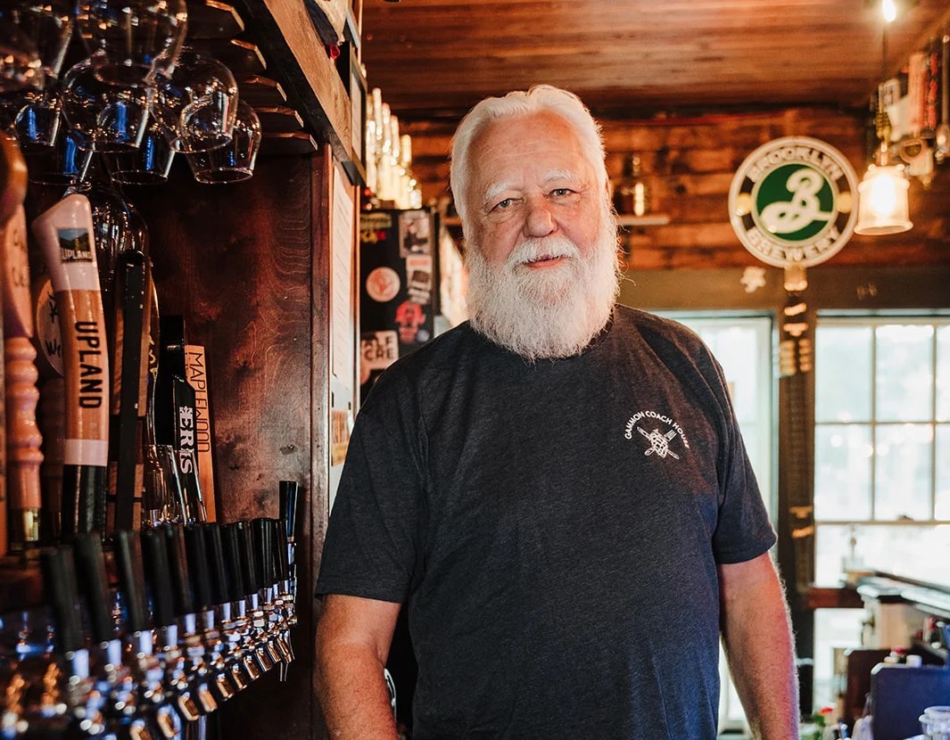 Jon With of Gammon Coach House stands behind the bar in his restaurant in Batavia Illinois