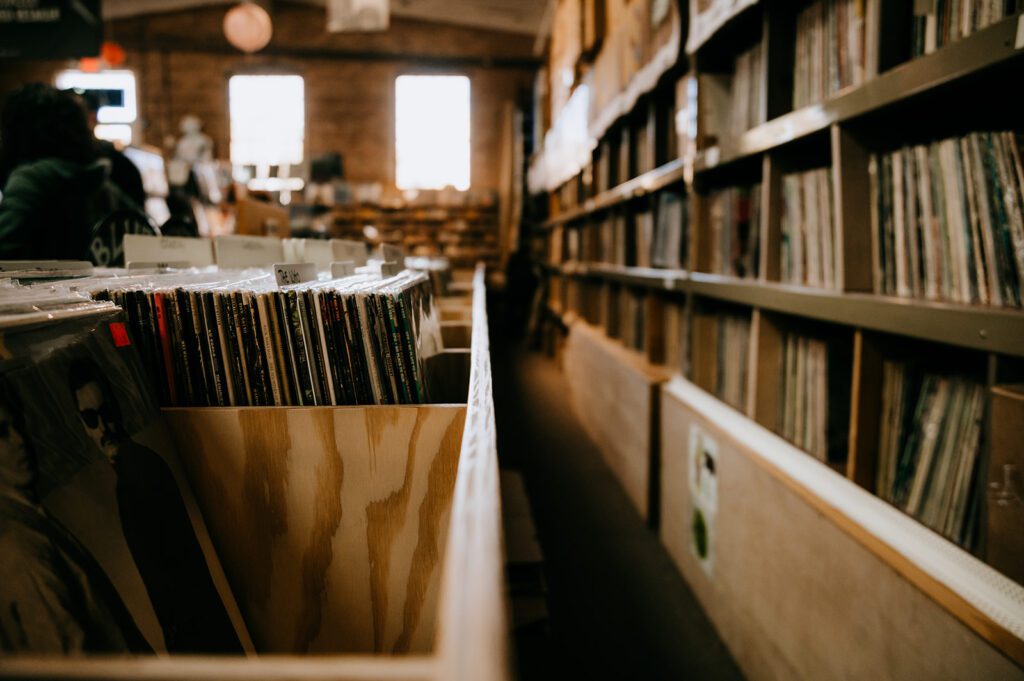 Wooden crates with vinyl records on display at Batavia record store Kiss the Sky Records. 