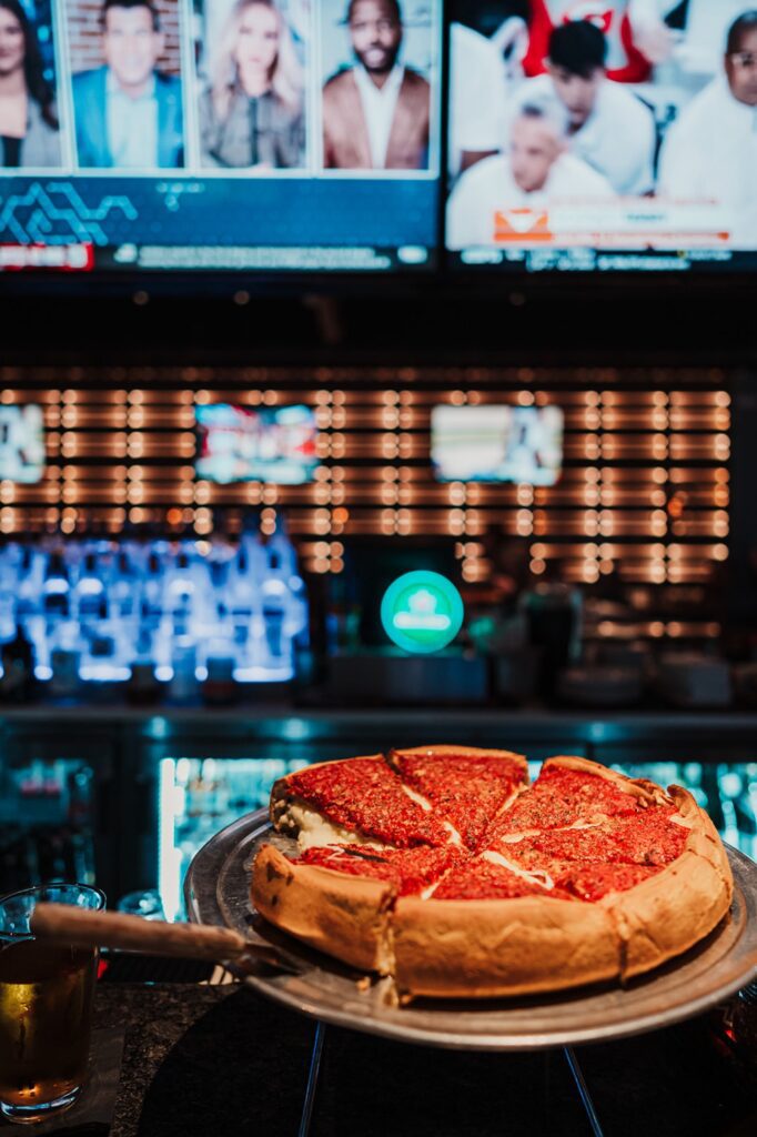 A deep dish pizza sits on the bar at Riverside Pizza in Batavia Illinois.