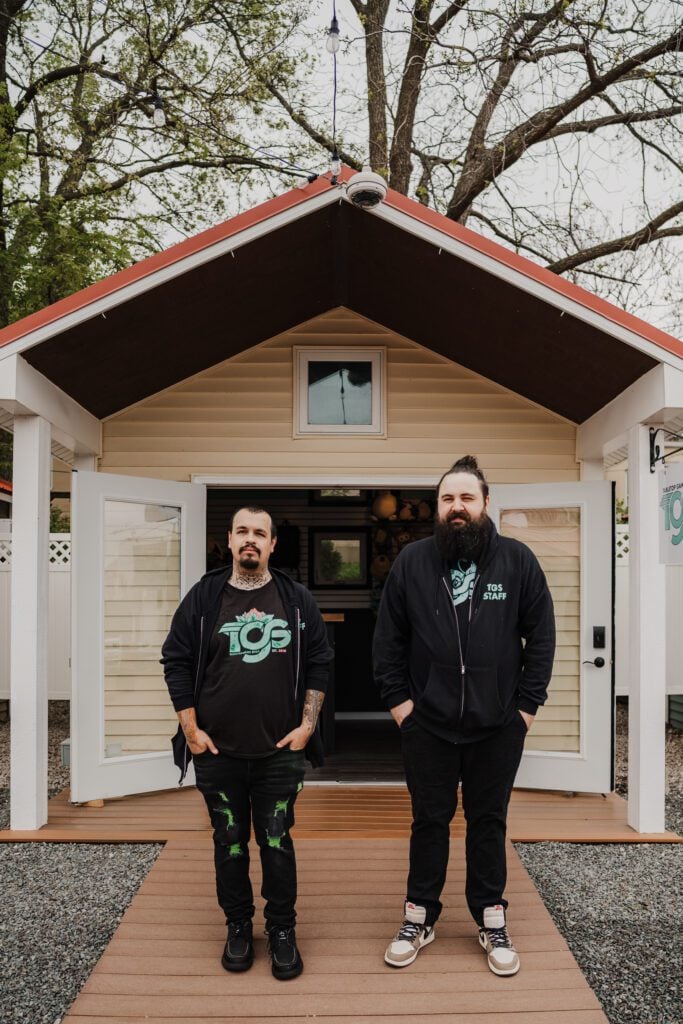 The owners of Table Top Game Shop outside their Batavia Boardwalk Shop.